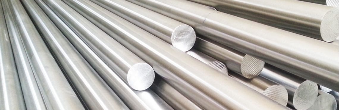 Here's an alt tag for the image: `Stacked metal rods`